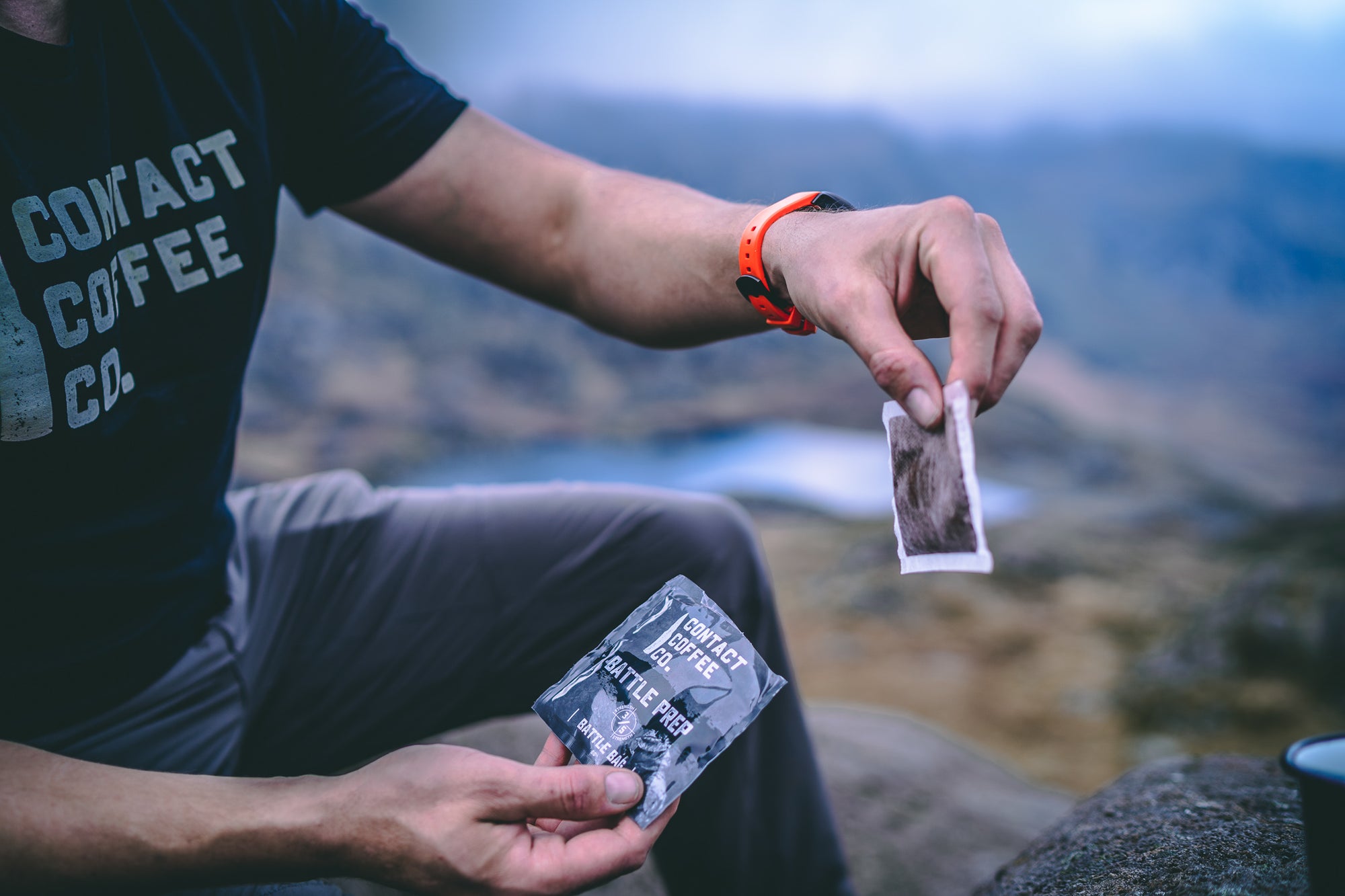 Man using a coffee bag outdoors