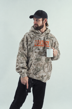Load image into Gallery viewer, Luke wearing Contact Coffee Tree Camo Fleece Hoodie