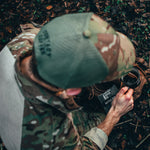  man in multicam using coffee bag outdoors